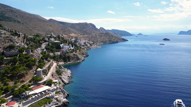 Aerial View Greek Island of Hydra Coastal Trail Boats and Ferries. Drone Along Coastline Harbor Port of Greece European Summer Travel Tourism