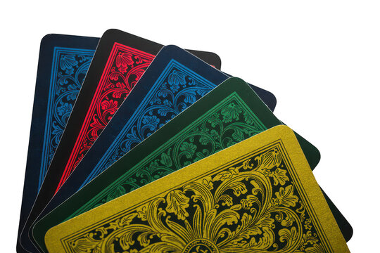 A fanned out hand of playing cards with decorative floral patterns on the back in blue, red, green, and yellow colors on black background