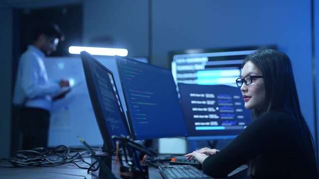 Programmer professional female working on software development, Asian IT developer coding for SaaS platform and cybersecurity network, Modern technology and computer programming business concept