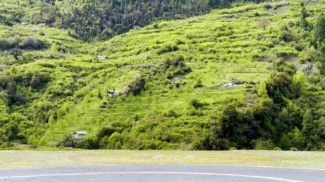Helicopter landing at Yamunotri Helipad which has beautiful surroundings of lush green mountains