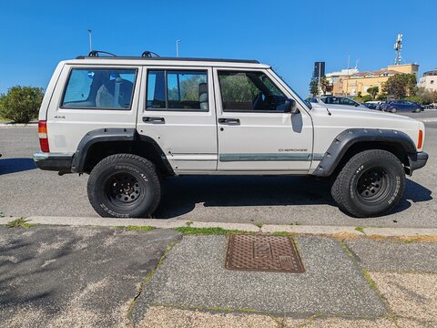 Ostia, Rome - June 9, 2026, an old Jeep Cherokee, historic Jeep Cherokee XJ series, produced from 1984 to 2001. This iconic off-road vehicle is considered the pioneer of modern compact SUVs.