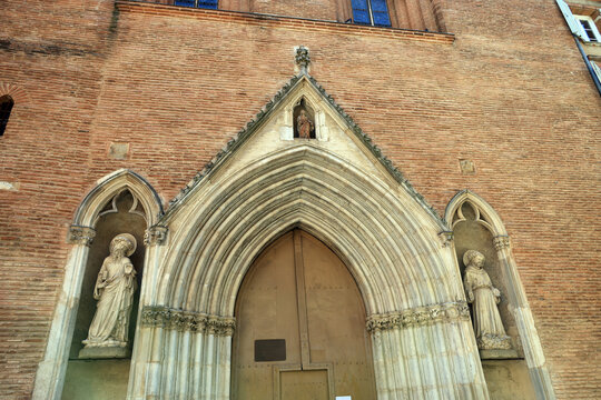 Gothic religious figures at the entrance to the entrance of the church of Notre Dame du Taur in the French city of Toulouse