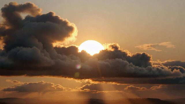 Golden Sun Behind Dramatic Clouds at Sunset Over Scenic Sky