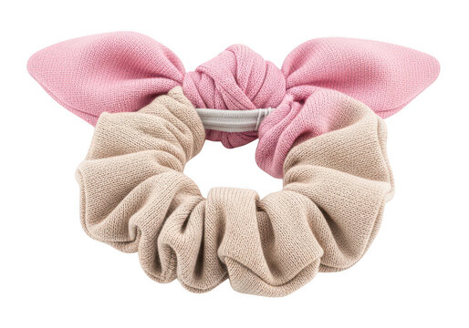 Soft fabric hair scrunchie with a pink bow and beige ruffled elastic band isolated on a transparent background
