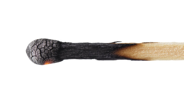 Burnt matchstick with cracked black head and wooden shaft