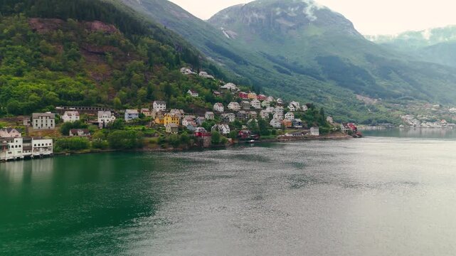 Aerial Drone View of Odda Town Surrounded by Mountains and Fjords, Norway