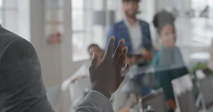 Presentation, man and meeting with business team for coaching, discussion or question in glass office. Person, speaker or group with hands raised for answer, interaction or engagement in workplace