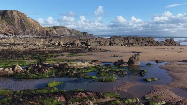 Wonderful rock seaweed and sandy Cornish beach