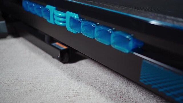 closeup of cushioning system of modern treadmill for running or workout