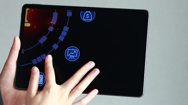 A hand is touching a tablet screen that shows a bank symbol surrounded by a circular graphic. This scene occurs during a tech demonstration, highlighting digital finance features.
