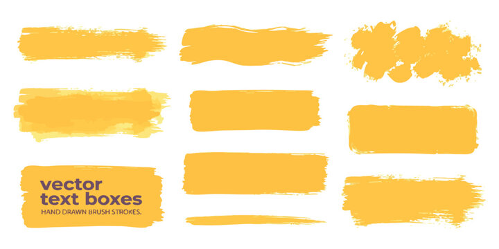Set of yellow hand drawn brush stroke shapes and abstract paint texture elements for creative design work