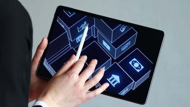 A business professional uses a digital tablet to engage with various icons representing applications. The setting is an office, with emphasis on technology and interaction.