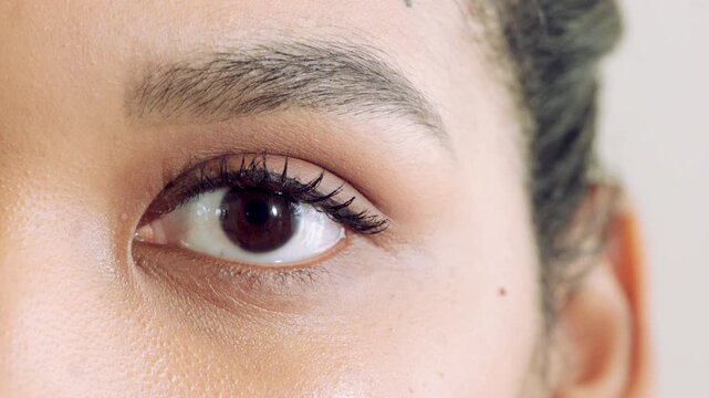 Face, mascara and makeup with eye of woman for beauty, cosmetics and self care closeup. Cosmetology, optical and eyelash extensions with person for lens vision, aesthetic and salon treatment