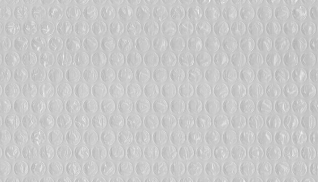 Transparent bubble wrap texture in top view. Abstract protective packaging background ideal for shipping, logistics, storage and design.