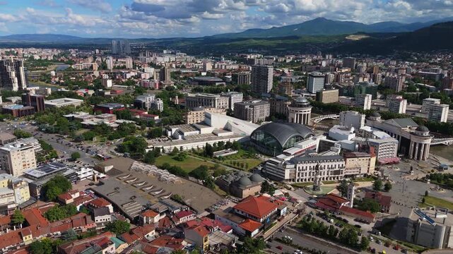 aerial cityscape view of  Skopje capital city  next to the Vardar river and city traffic in North Macedonia