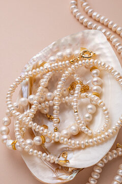 Lustrous white pearl necklaces inside a seashell