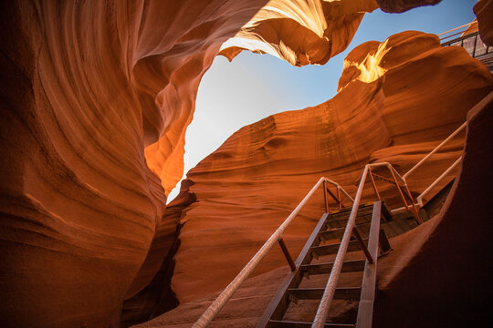 Metal staircase ascending inside a beautiful slot canyon