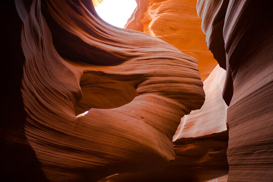 Natural light illuminates beautiful sandstone slot canyon walls