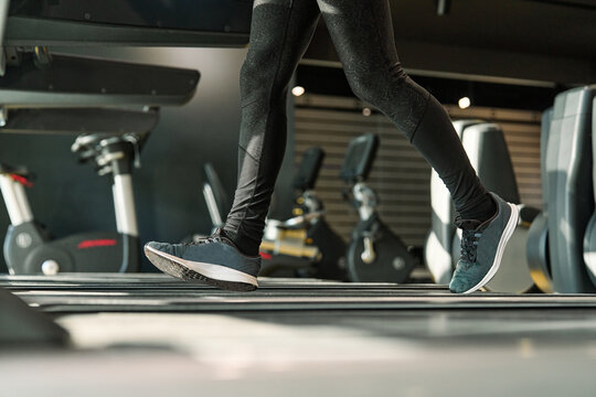 Close up on shoe, man running in a gym on a treadmill.exercising concept.fitness and healthy lifestyle