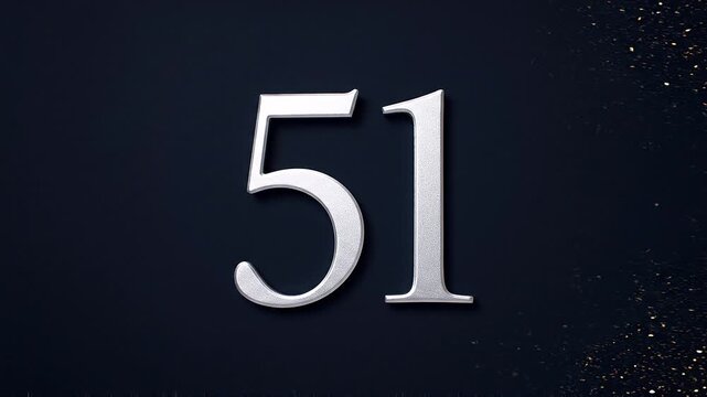 Gold Glitter Blow‑Away Reveal of Number 51 on Solid Background