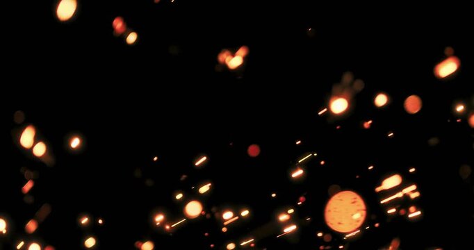 Dynamic metallic sparks and glowing lights on a dark background create a visually stunning effect, ideal for motion graphics and design projects needing creativity and unique flair