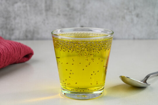 Serving nannari sharbat in a glass cup.