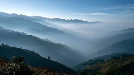 Naklejka premium Tranquil misty mountain landscape unfolds with layered peaks under a soft atmospheric light