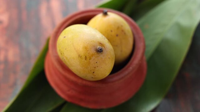 Traditional yellow fresh ripe mango curry Mampazha Pulissery sweet sour dish Kerala India . Made organic raw ripe mango, coconut milk, seasoned with curry leaves, mustard, Indian.