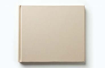 Fototapeta premium Plain beige fabric hardcover book lies flat isolated on white background. Simple, minimalist book cover for mockup. Clean, neutral base for design.