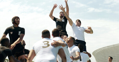 Outdoor, lifting and people with rugby match, defense training or collaboration for competition game. Tournament, fitness and players with teamwork for line out, sports practice or active for contest © peopleimages.com
