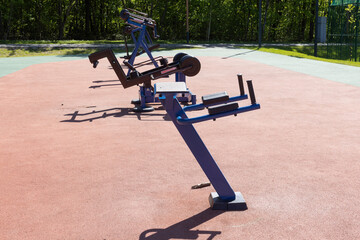 Obraz premium Outdoor plate loaded training machines on a public fitness ground