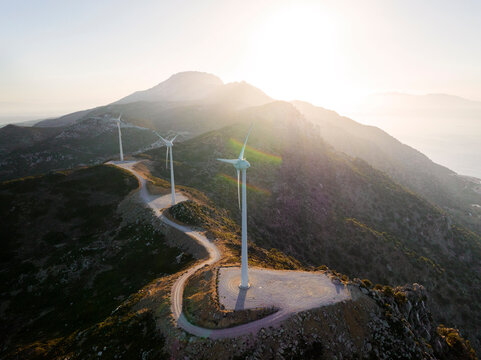 Greece, Aegean, Kos, Wind farm turbines at sunrise