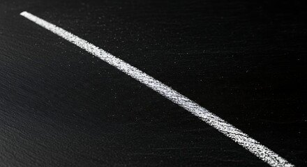 Fototapeta premium White Chalk Line Drawn Across Dark Blackboard Surface
