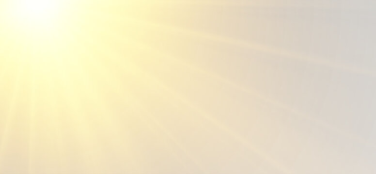 Abstract gray backdrop with diagonal yellow light rays overlay effect from the left.