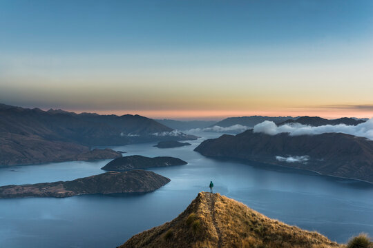 New Zealand, South Island, Wanaka, Otago, Woman on Coromandel peak at sunrise