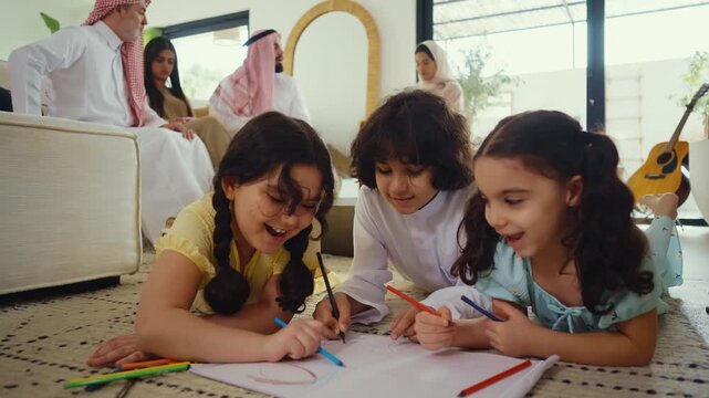 Multi-generation arab family wearing traditional saudi clothing smiling together in modern home
