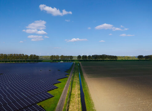 Aerial view of a solar farm and field in Ooltgensplaat