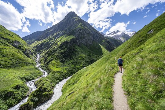 Mountaineer on a hiking trail in the Umbaltal valley, Isel and Daberbach mountain streams, Venediger Group, Hohe Tauern National Park, East Tyrol, Tyrol, Austria