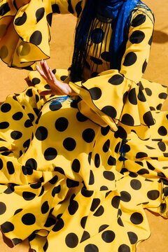 Yellow flamenco dress with black polka dot and ruffle detail