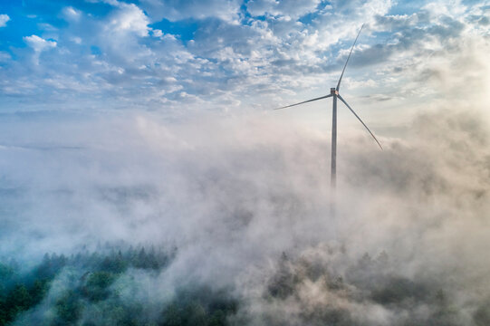 Germany, Baden-Wuerttemberg, Schurwald, Aerial view of wind wheel and morning fog