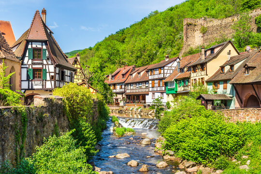 Historic half timbered houses along river in Kaysersberg France