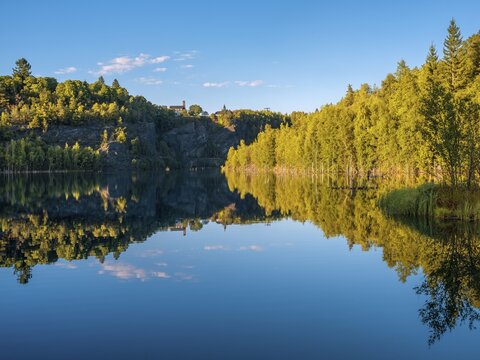 The slate lake in the Kie&szlig;lichbruch in the evening light, former slate quarry, birch forest on the shore, Technical monument of the historic slate mining Lehesten, Thuringia, Germany