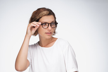 Fototapeta premium Focused Young Woman in Glasses Representing Modern Education Concept