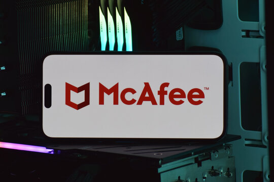 On a mobile phone screen logo McAfee Corp global computer security software company.