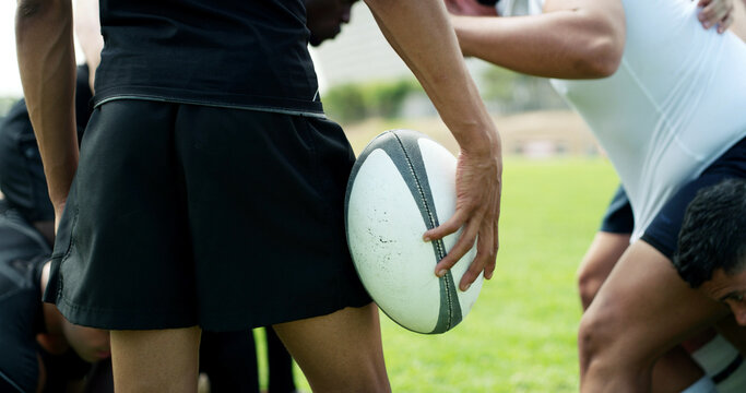 Rugby, training and hands of man with ball on field for tournament match, cardio and competition. Sports, athlete and player with exercise, workout and fitness for practice, performance or contest