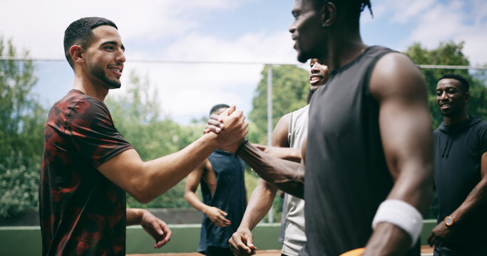 Fitness, friends and men with handshake on basketball court, celebration or introduction for match. Outdoor, smile or people with opposition team for greeting, shake hands or competition support