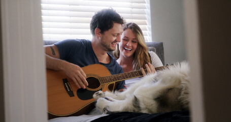 Guitar, husky and laughing with couple in home together for bonding, connection or security. Dog, music and pet owner people playing instrument in apartment for break, funny or humor on weekend © peopleimages.com
