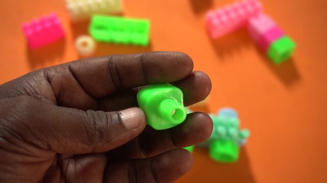 Colorful interlocking plastic building blocks for educational play, creativity development, problem-solving skills, and imaginative learning activities.