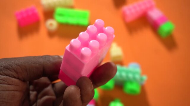 Colorful interlocking plastic building blocks for educational play, creativity development, problem-solving skills, and imaginative learning activities.