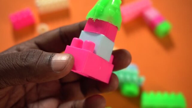 Colorful interlocking plastic building blocks for educational play, creativity development, problem-solving skills, and imaginative learning activities.